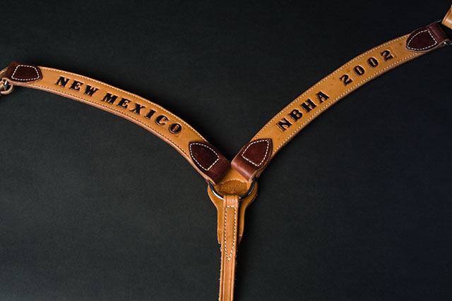 a breastcollar with tooled award plaque