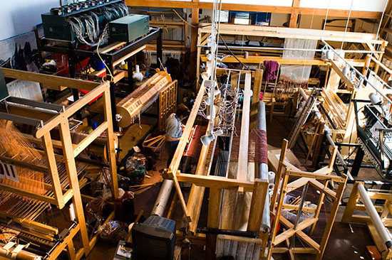 a view of the studio showng several of our looms in use